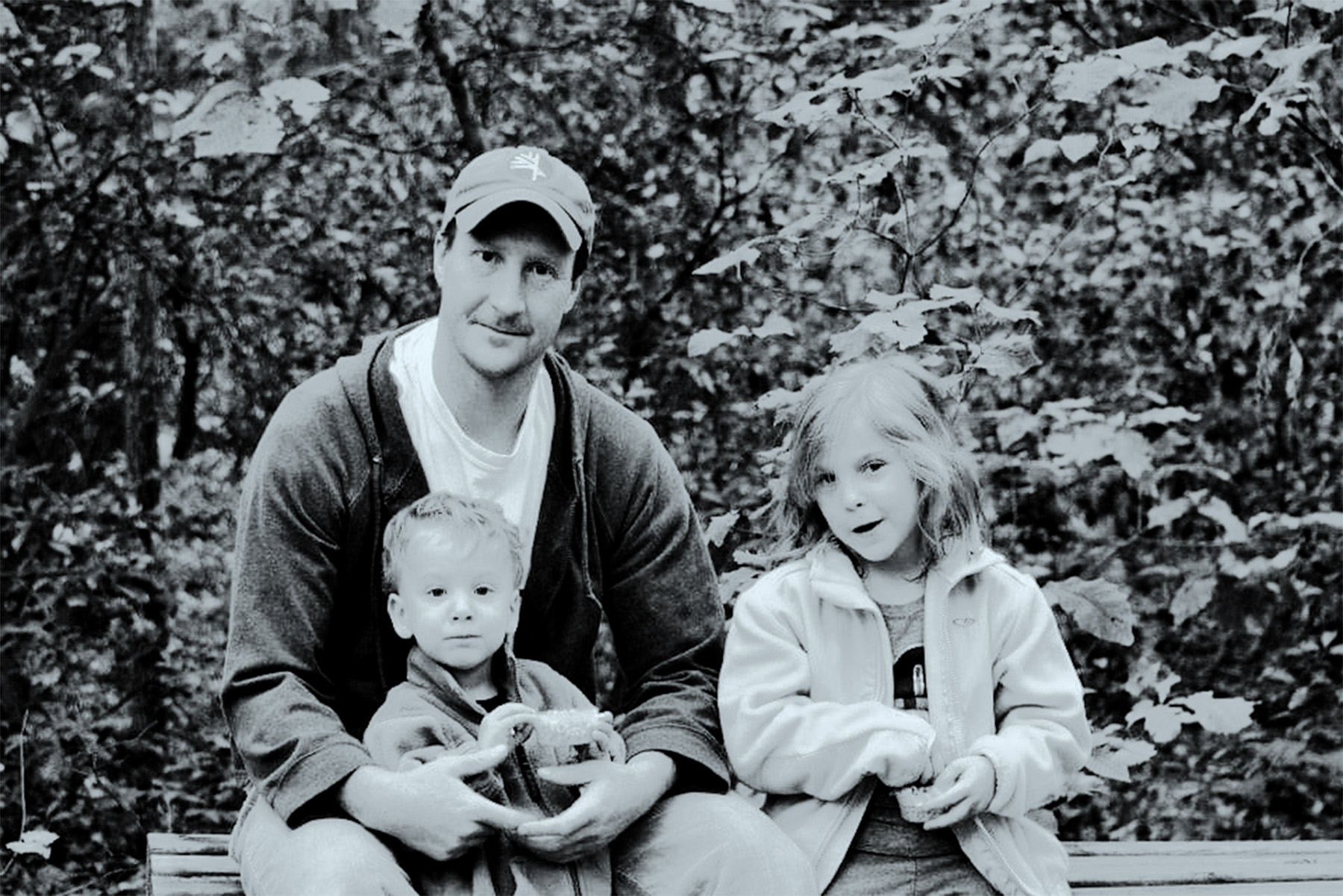 black and white photograph of Ian Copland and his two children